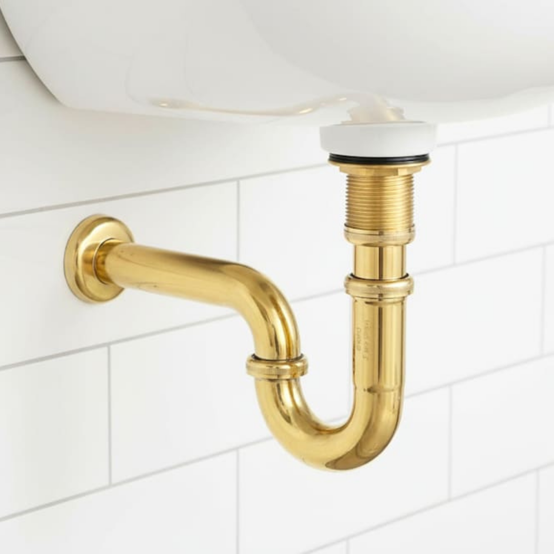 Unlacquered Brass P-Trap Kit installed under a bathroom sink