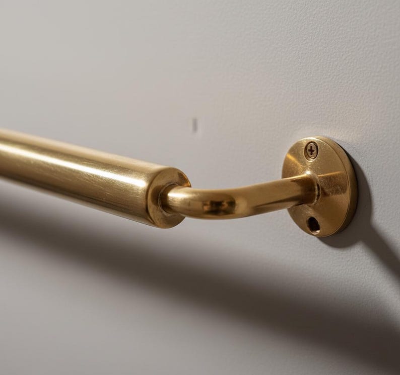 Detailed view of hand-finished brass towel rail