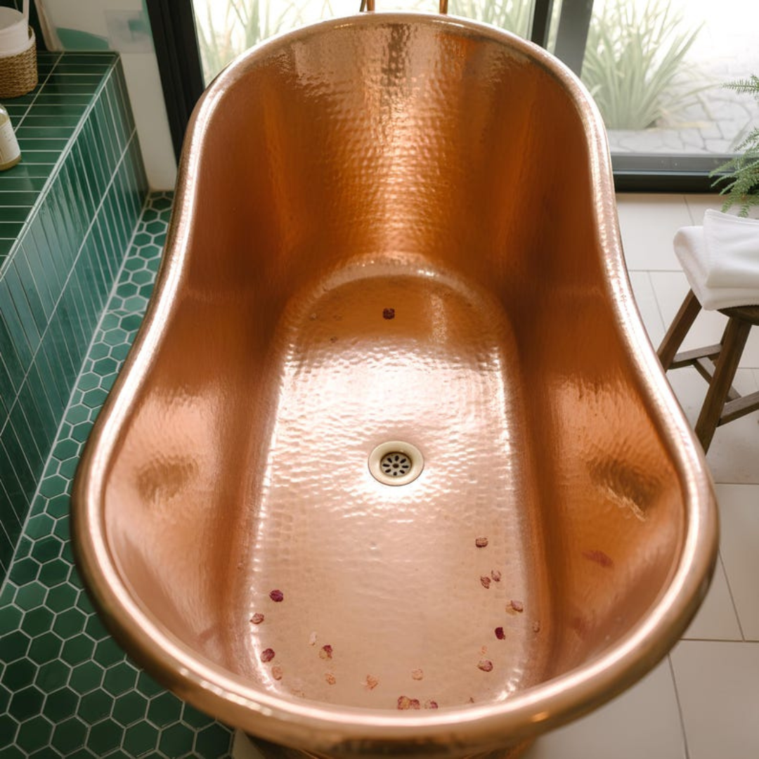 Copper bathtub lifestyle — organic bath oils and botanicals beside the exterior