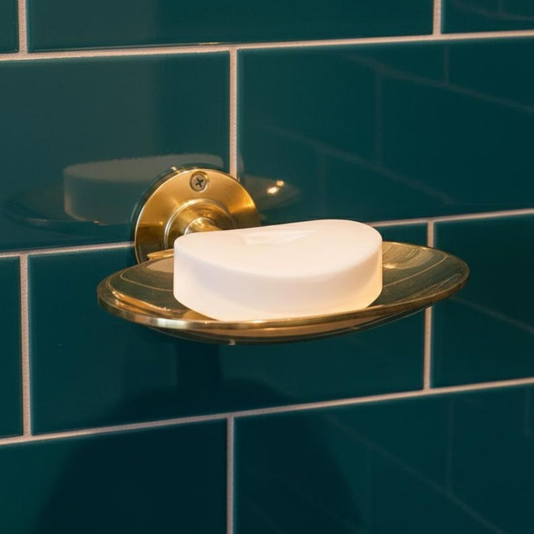 Detailed view of hand-finished brass soap dish