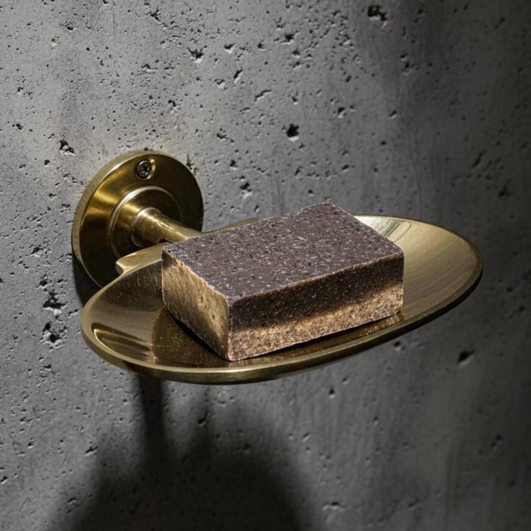 Brass soap holder matching a luxury bathroom decor
