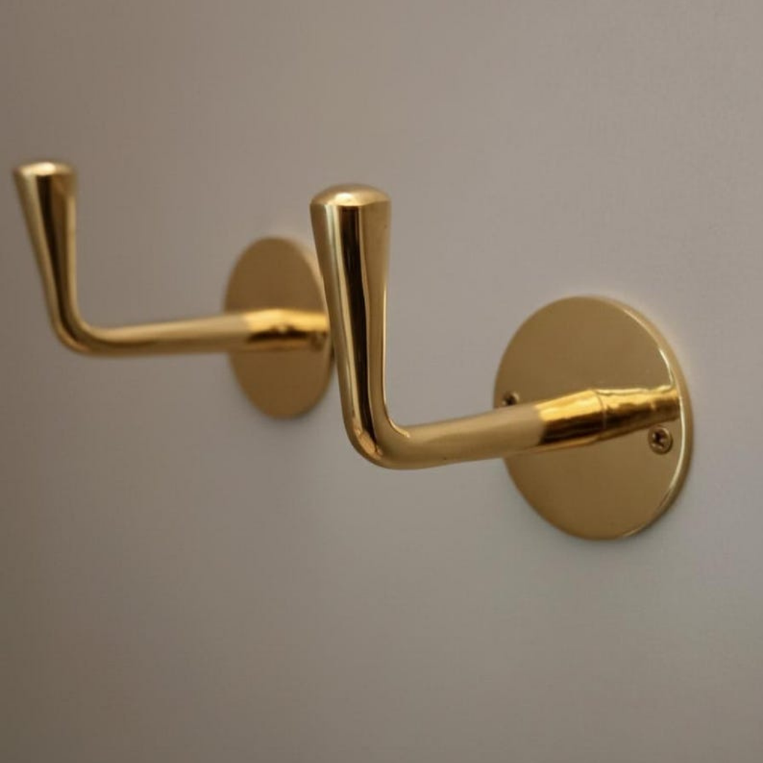 Detailed view of hand-polished brass wall hook