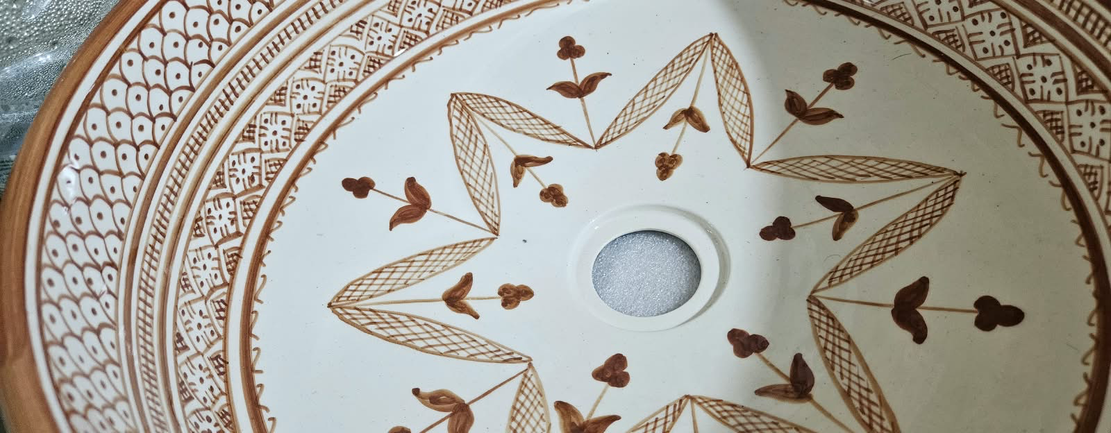 Sienna original workshop photograph — interior star, flowers, and glaze detail