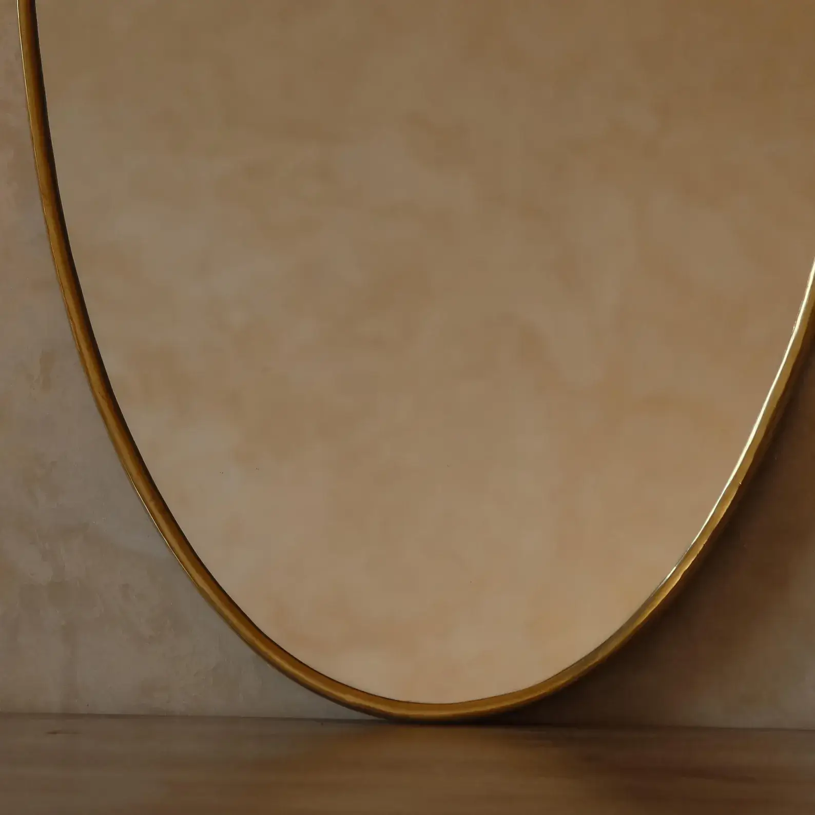 Zahra Sculptural Organic Brass Mirror editorial detail