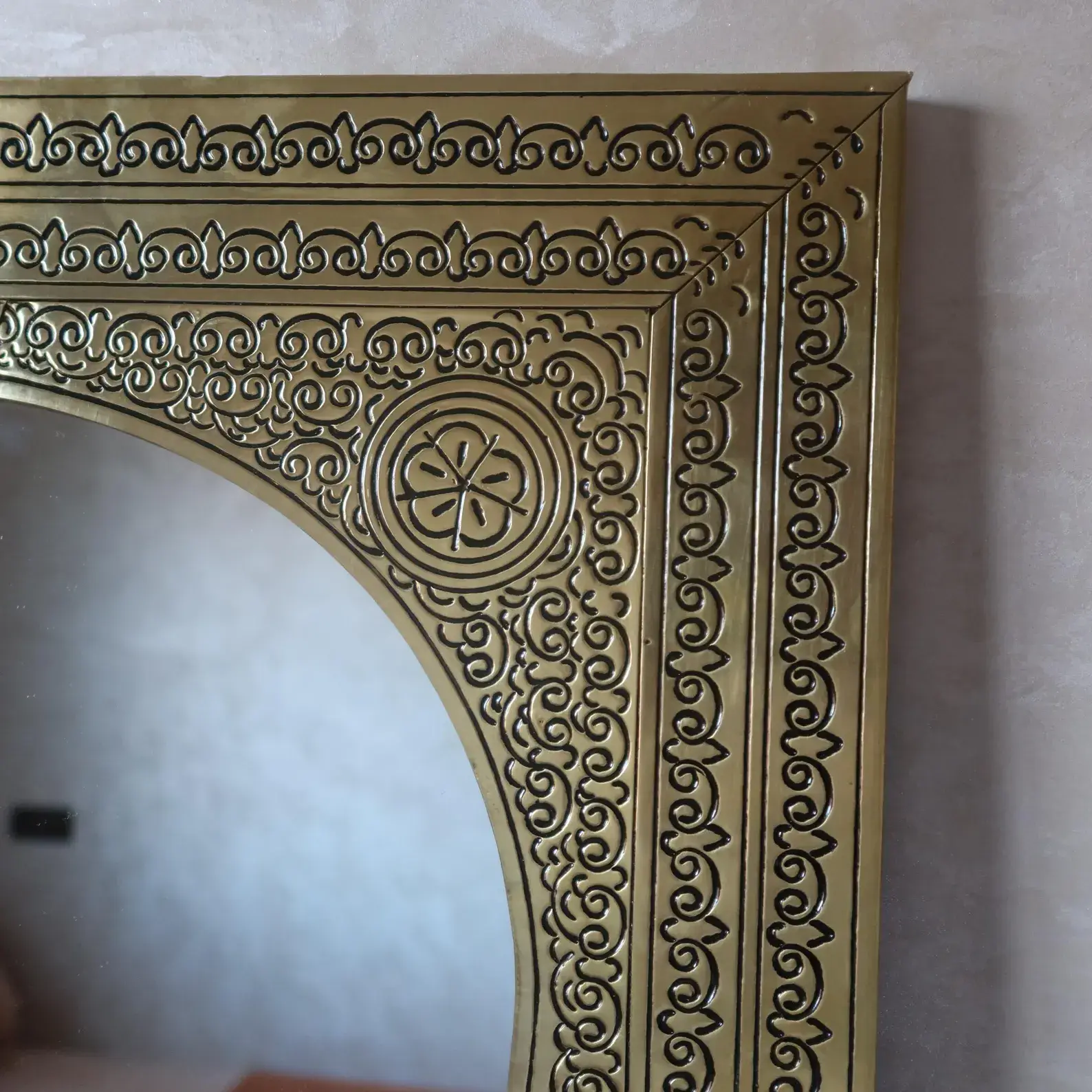 Fez mirror hand-chiseled arabesque engraving close up